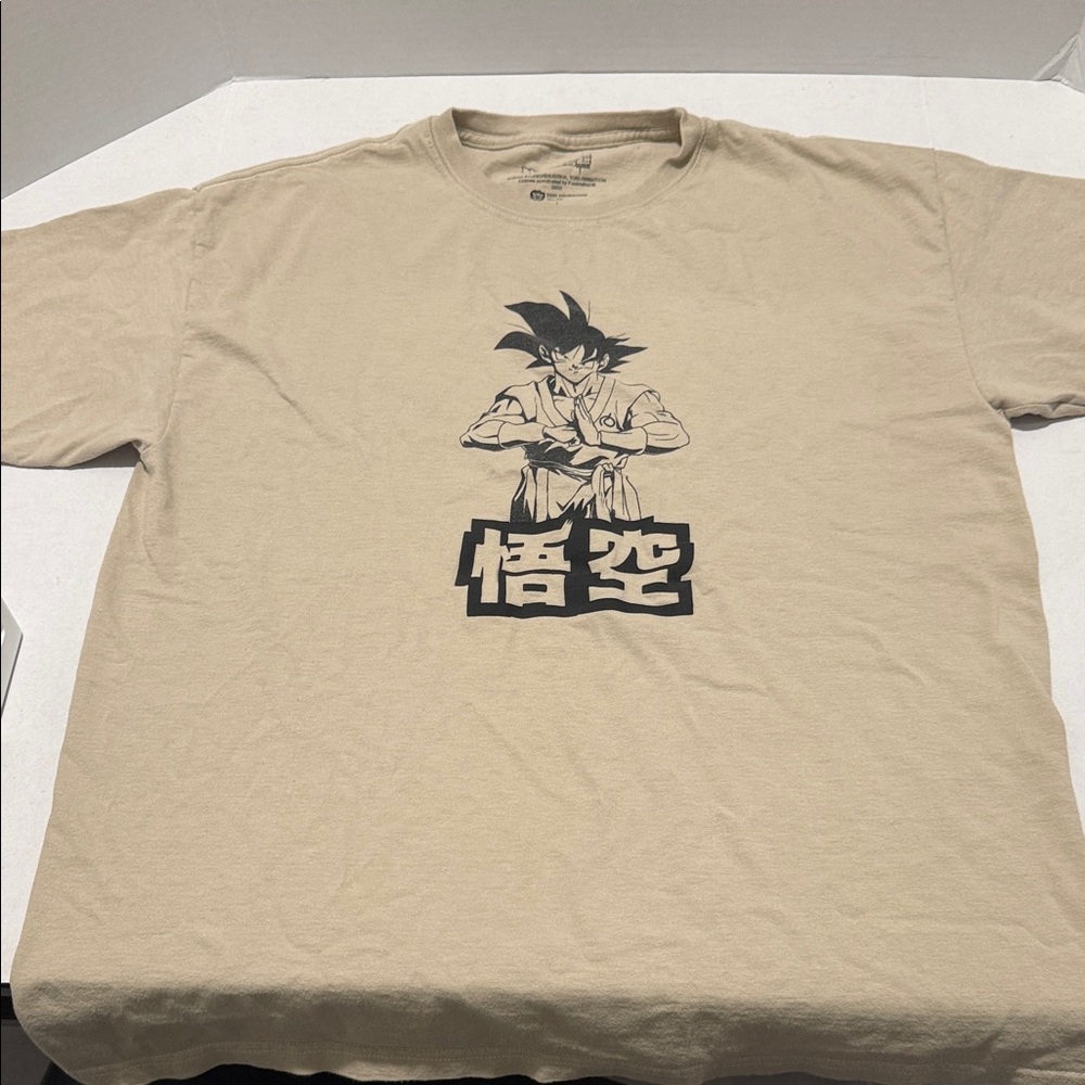 Beige Graphic Tee with Bold Design